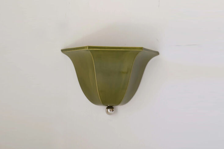the maeve sconce is available in olive (shown) and garnet; \$338. 21