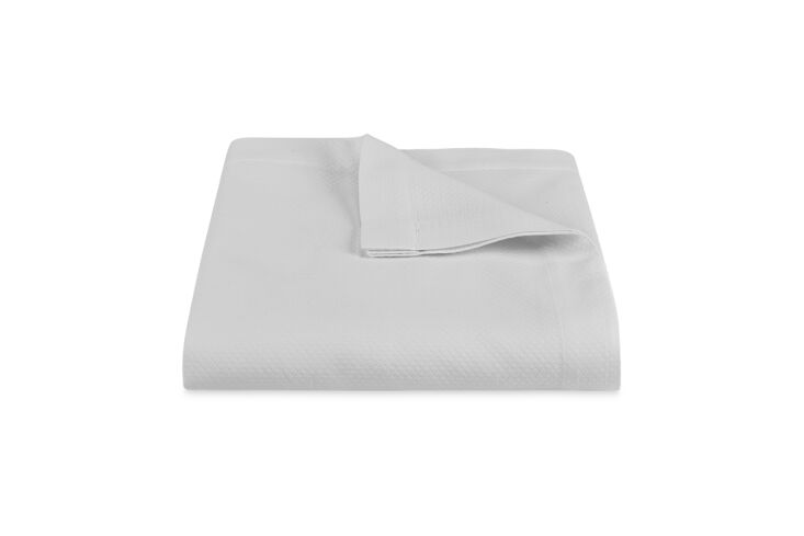 the elliott coverlet in silver is a good lookalike to the bedspread, and just e 24