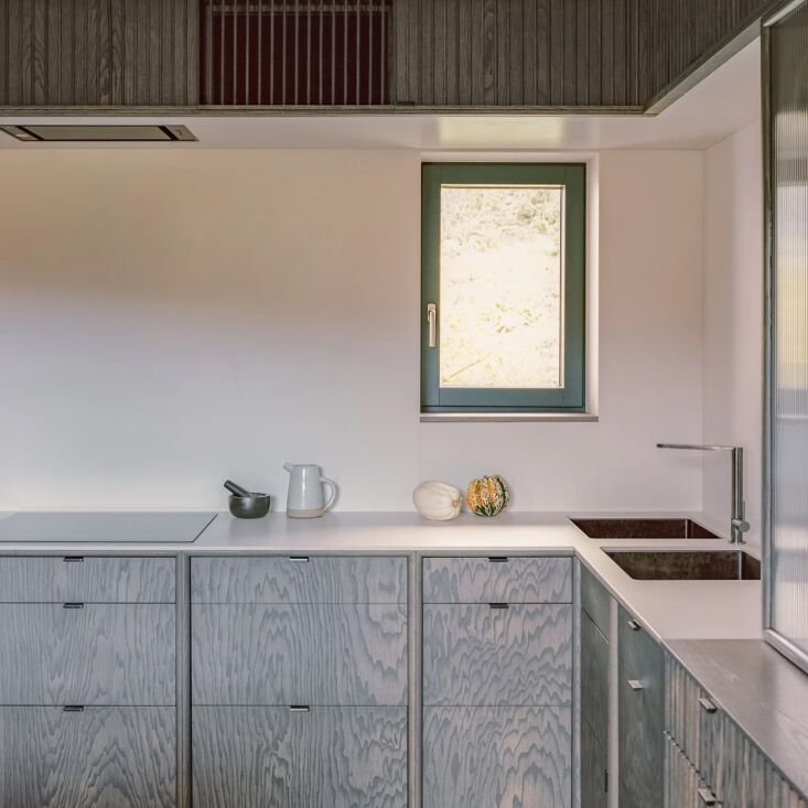 in a project by welsh studio rural office, ash kitchen cabinets by studio pren  22