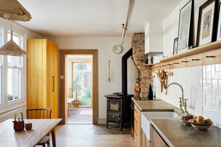 in the kitchen of seb and brogan cox, the couple integrated a glowing yellow pa 20