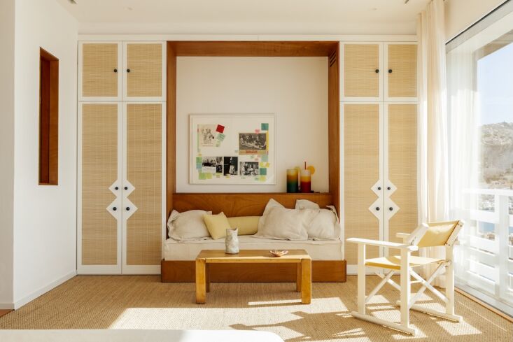 a built in sofa is flanked by cabinets with woven reed insets—to see more, go 22