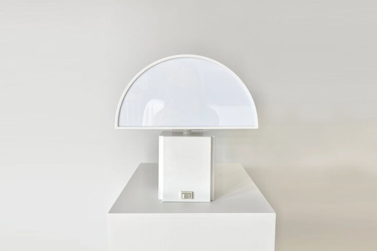 the twin bedside lamps are original \1970s olympe lamps are by harvey guzzini f 21