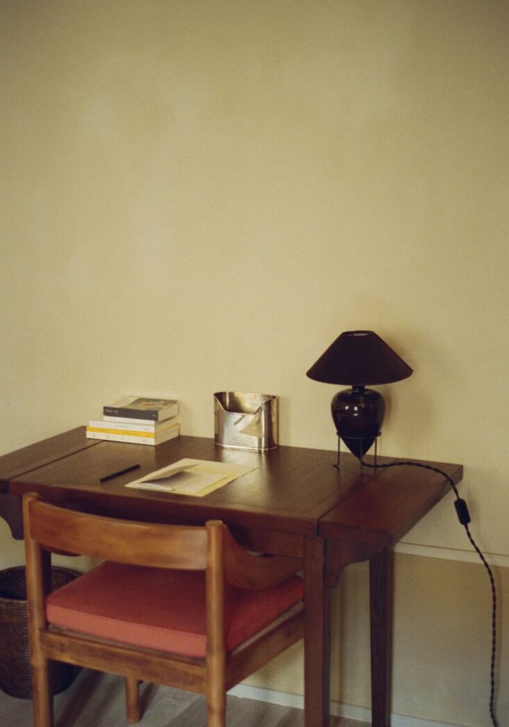 the vittoria table lamp has a ceramic body and cast iron base and is available  22