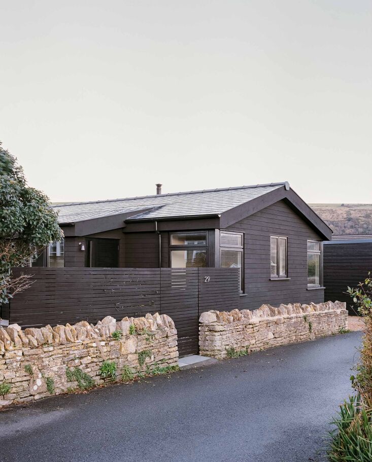 the british western red cedar cladding was finished with black linseed paint to 26