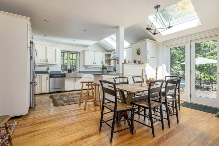 the kitchen, before: jutting out fridge, post, awkward skylights, and all. 25