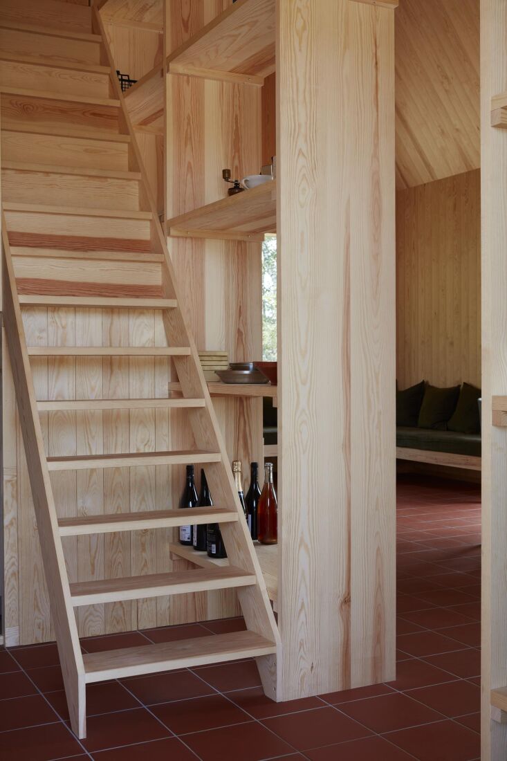 a ladder leads up to the lofted area of the house which spans about half the sq 24