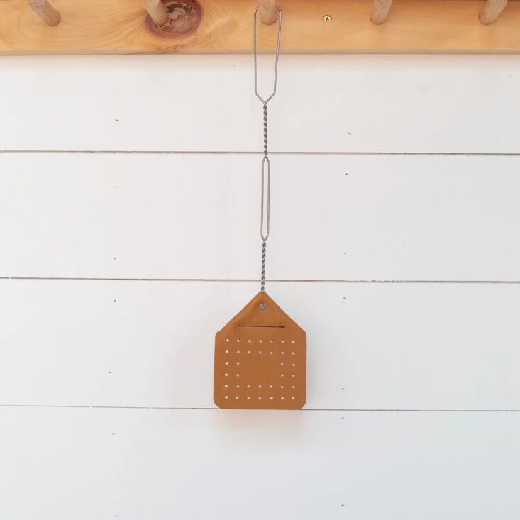 the leather flyswatter is particularly useful in a beachfront summer cottage. t 29