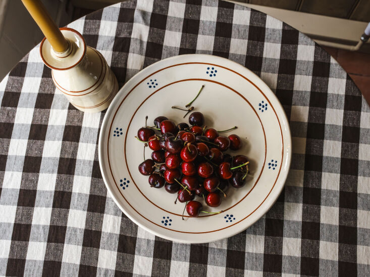 the margot serving plate sits atop the margot chocolat gingham tablecloth, whic 27