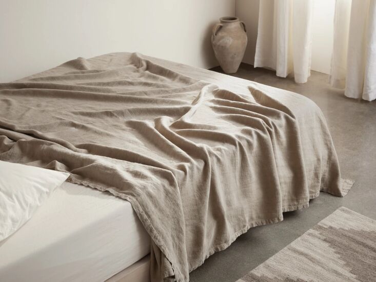 the vintage linen bed blanket is available in natural (shown), antique white, m 18