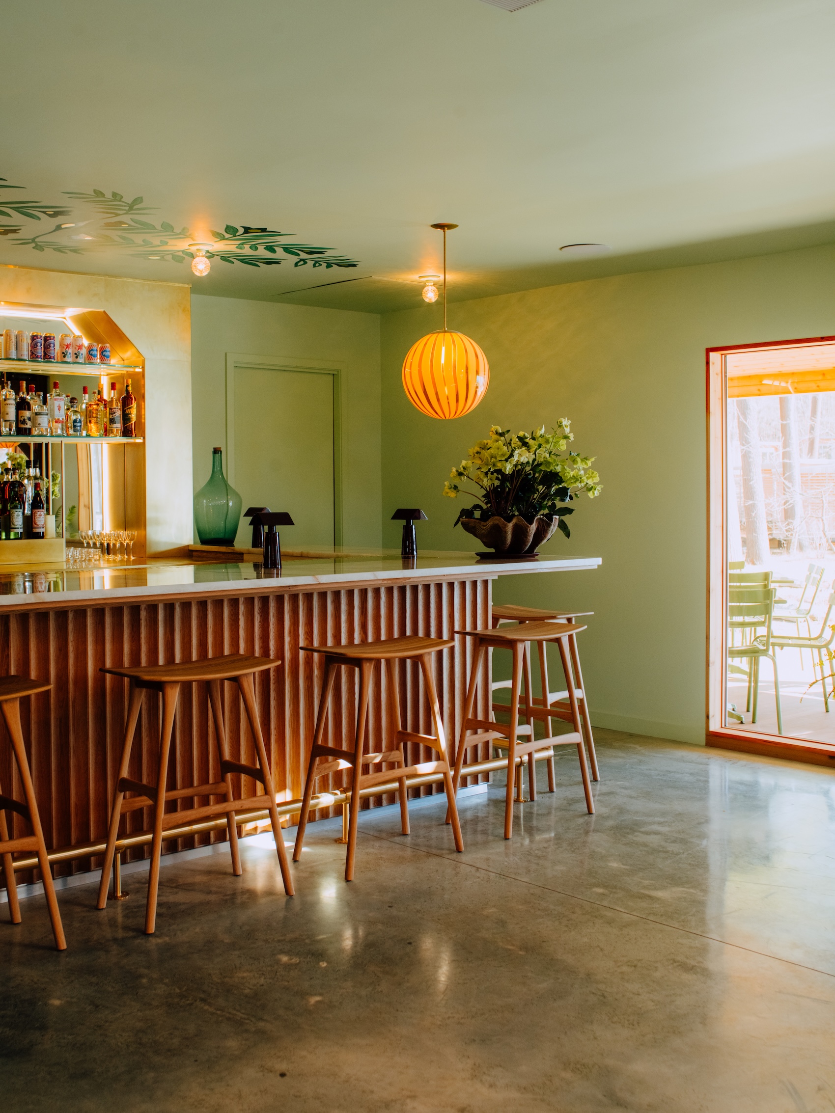in the bar, ethnicraft osso stools and a murano striped globe light from denmar 25