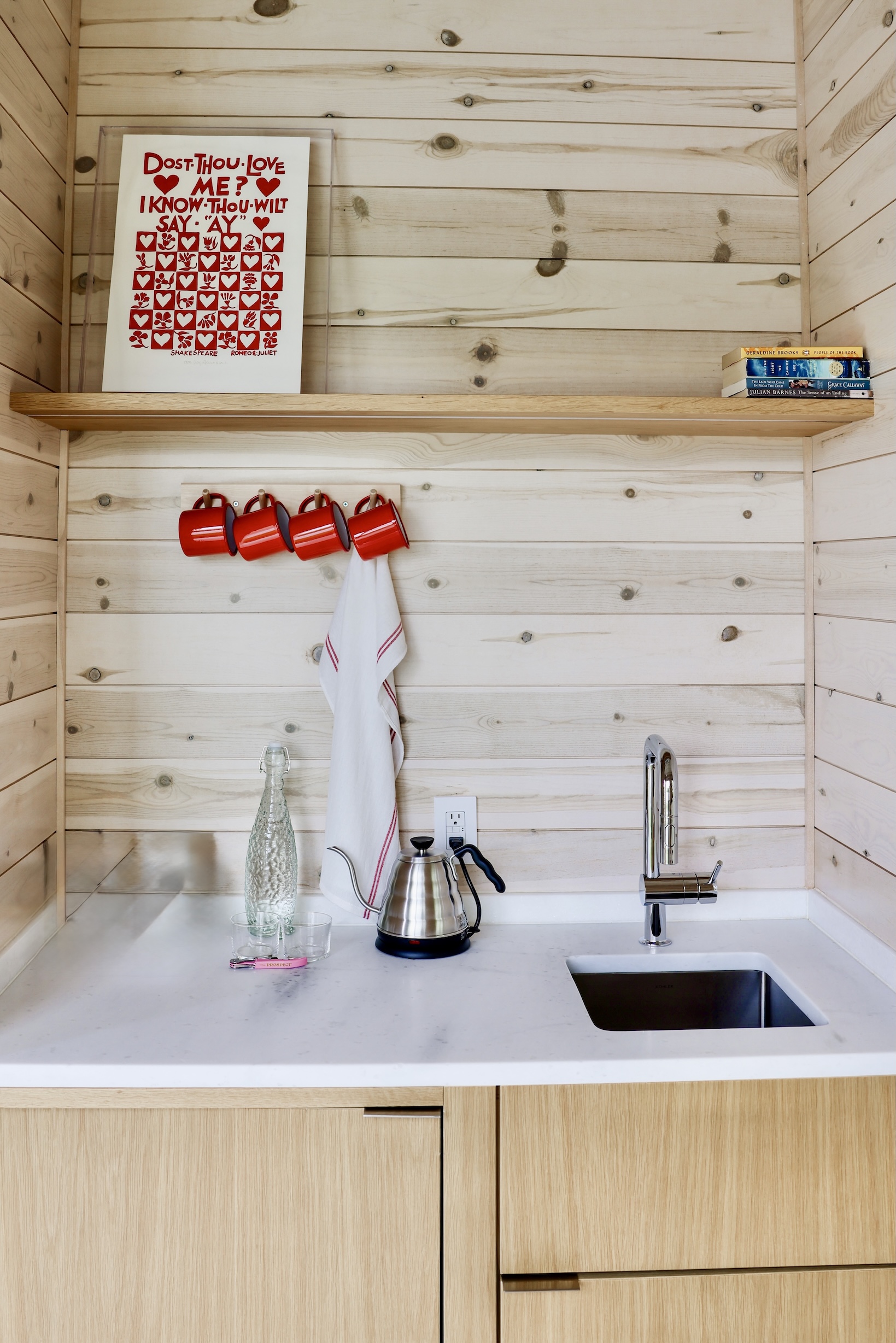 each cabin has a kitchenette and a stack of vacation reading. photograph by all 22