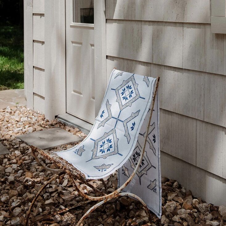 the heirloom embroidered table throw no. 6\27\1, woven through with cobalt, is  20