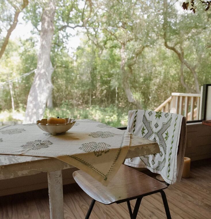 the heirloom embroidered table throw no. 6\267, threaded through with green, is 17