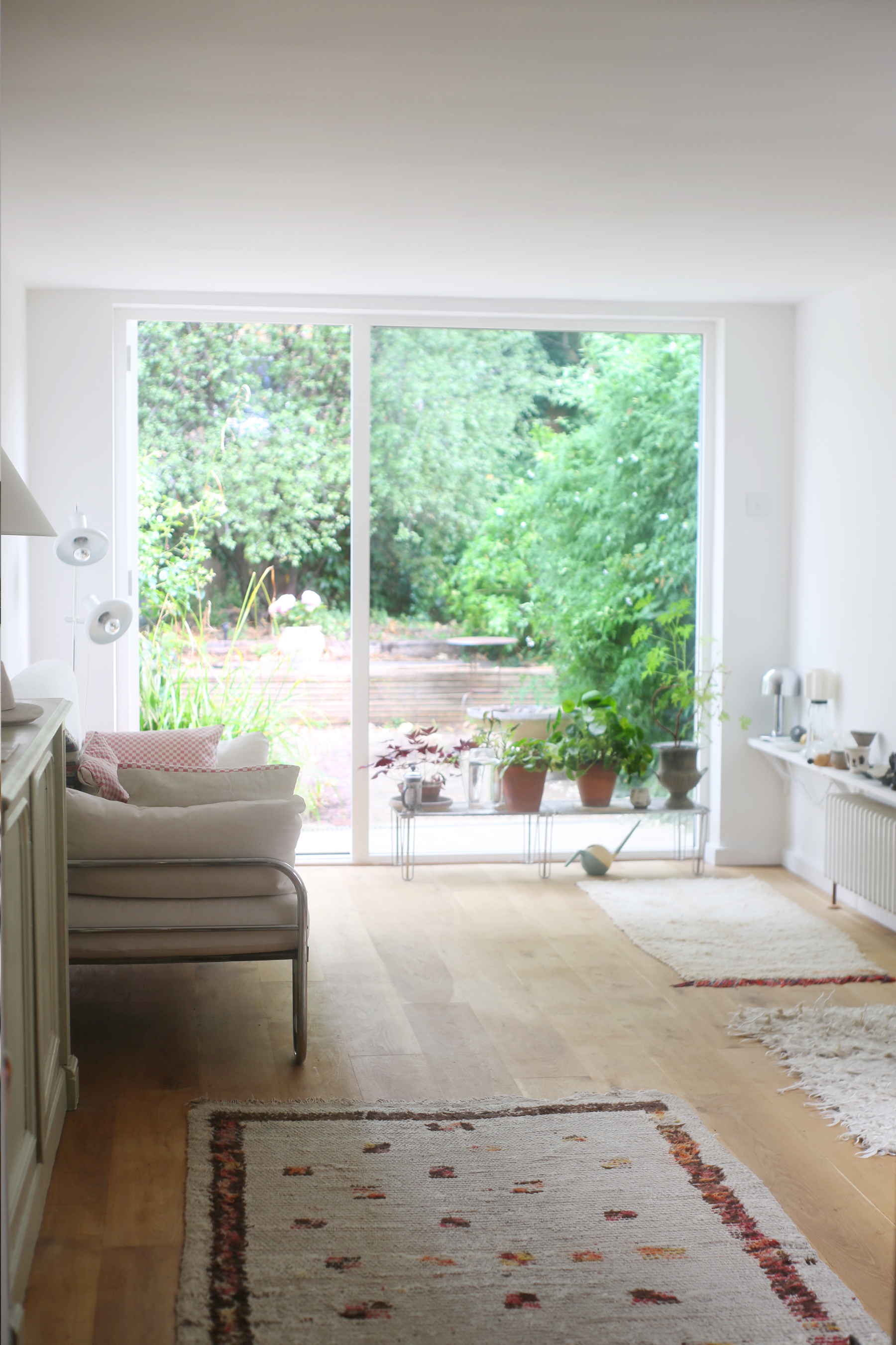 the small sitting room was transformed by the addition of a white framed slidin 23