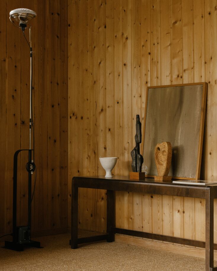the interior walls are all original pine cladding. the floor lamp is the flos t 21