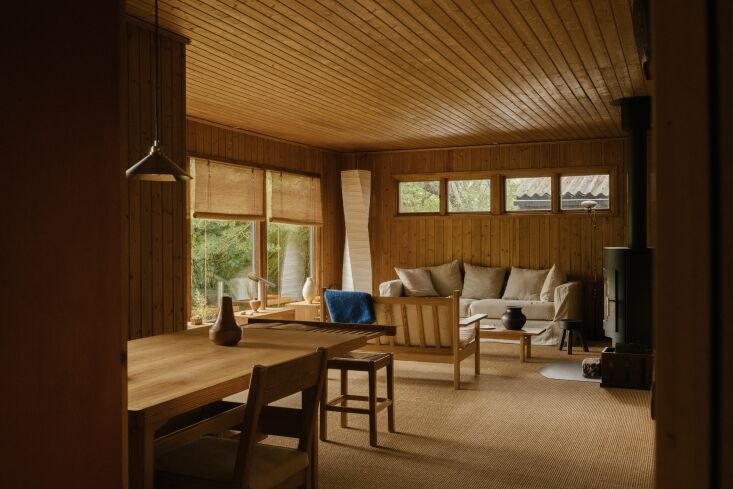 a wide view of the living room reveals the wood burning stove original to the h 22