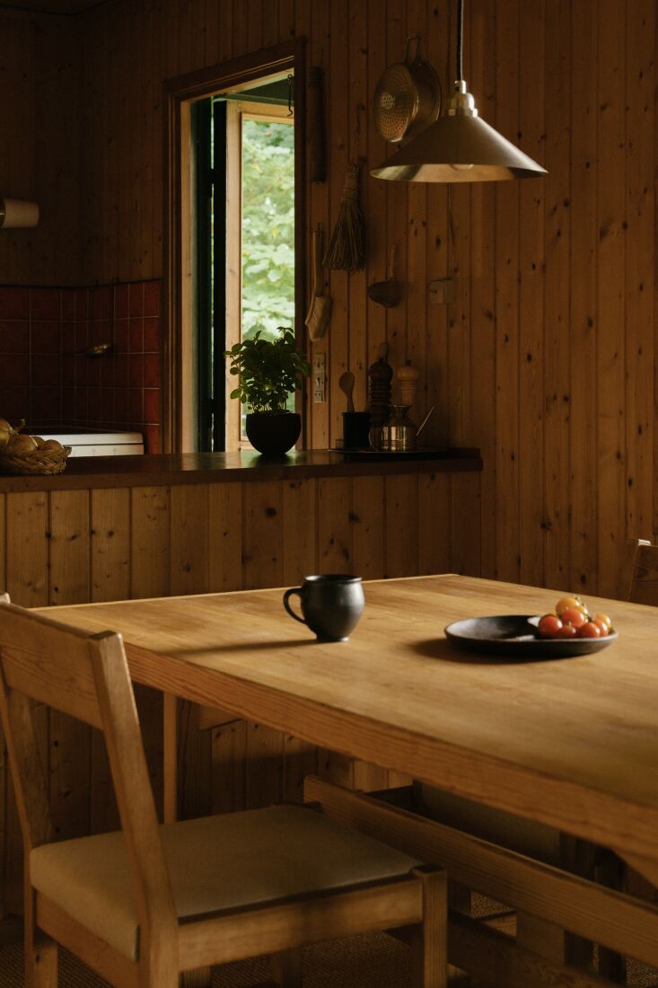 hanging above the dining table is the frama cone shade. 23