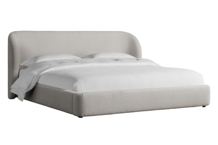 the bed frame is the fully upholstered adalynn bed frame in a bouclé fabric; \ 23