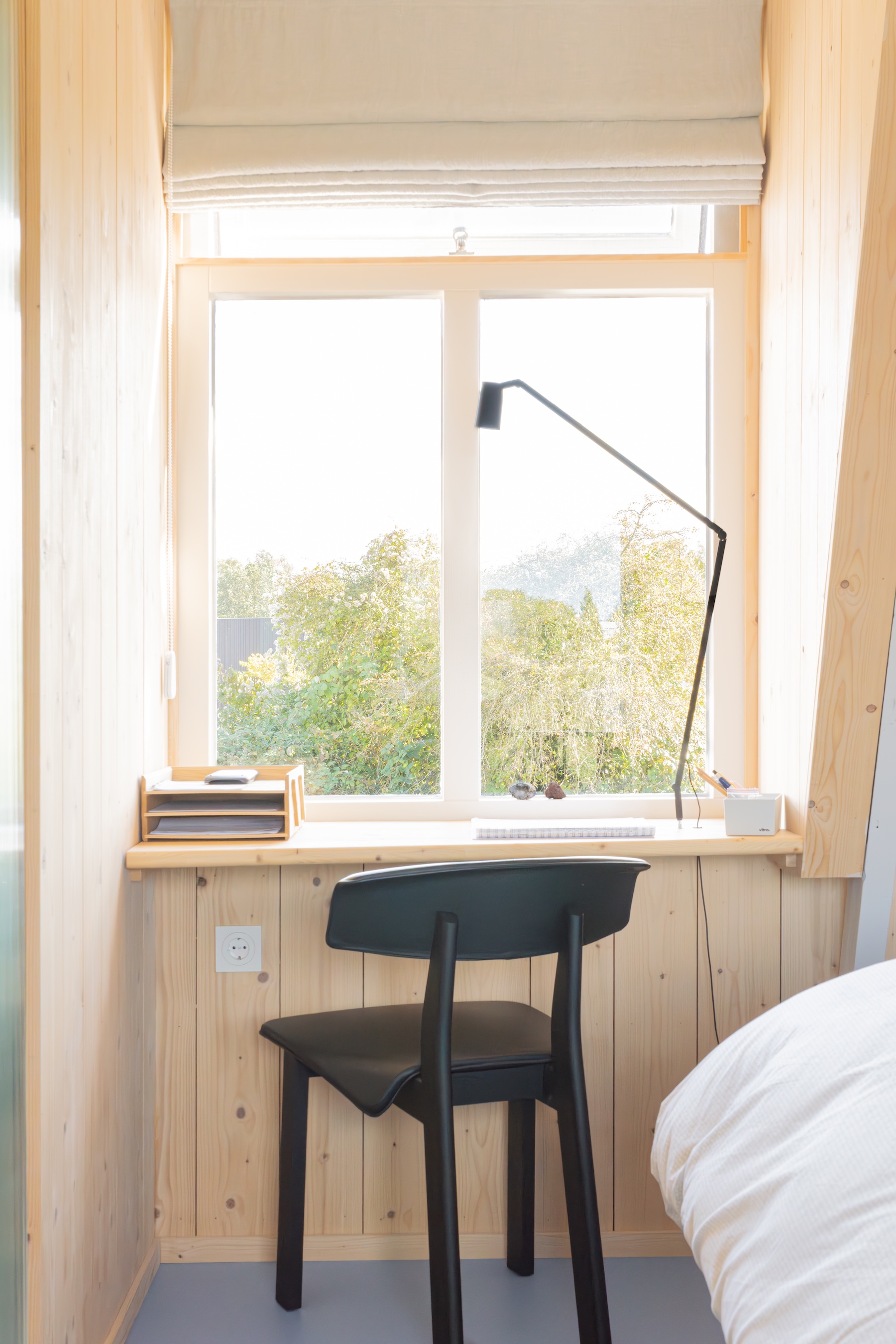 aron entirely paneled the bedroom and added a built in a desk with a view. the  27