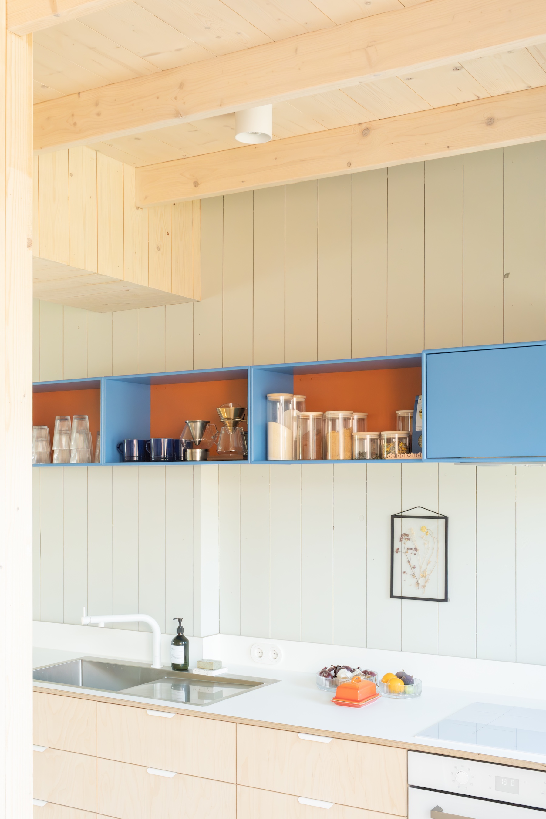 the kitchen cabinets are birch plywood with a thin laminate counter and a barel 22