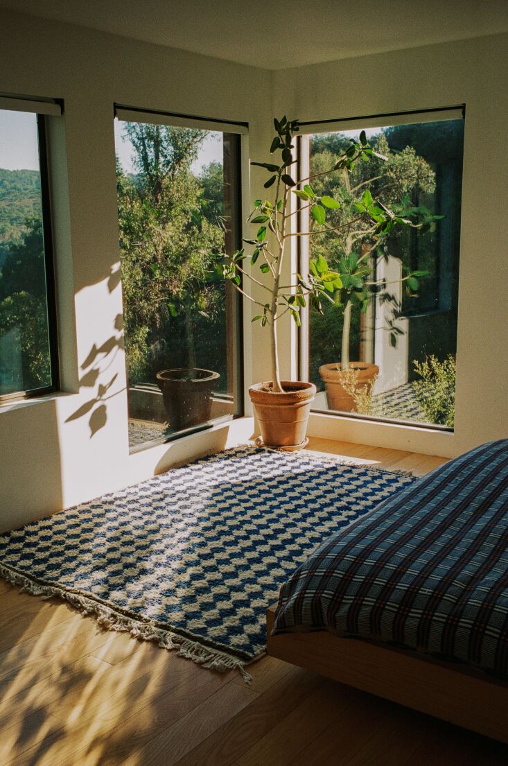 a bedroom kitted with various textiles spanning japan (the coverlet) and morocc 27