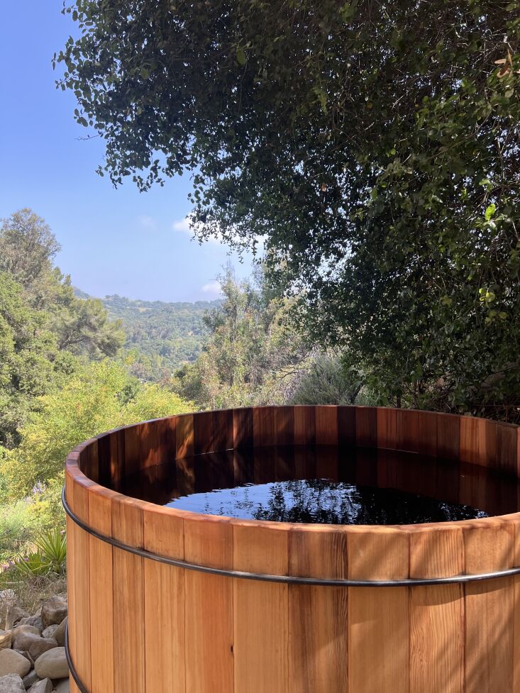 the hot tub is a cedar hot tub from northern lights. (for more outdoor hot tubs 31