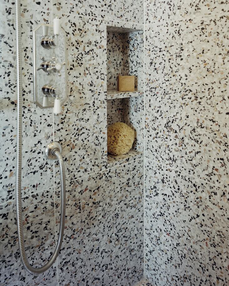 set among wide terrazzo tiles is a hudson reed thermostatic shower faucet. 24