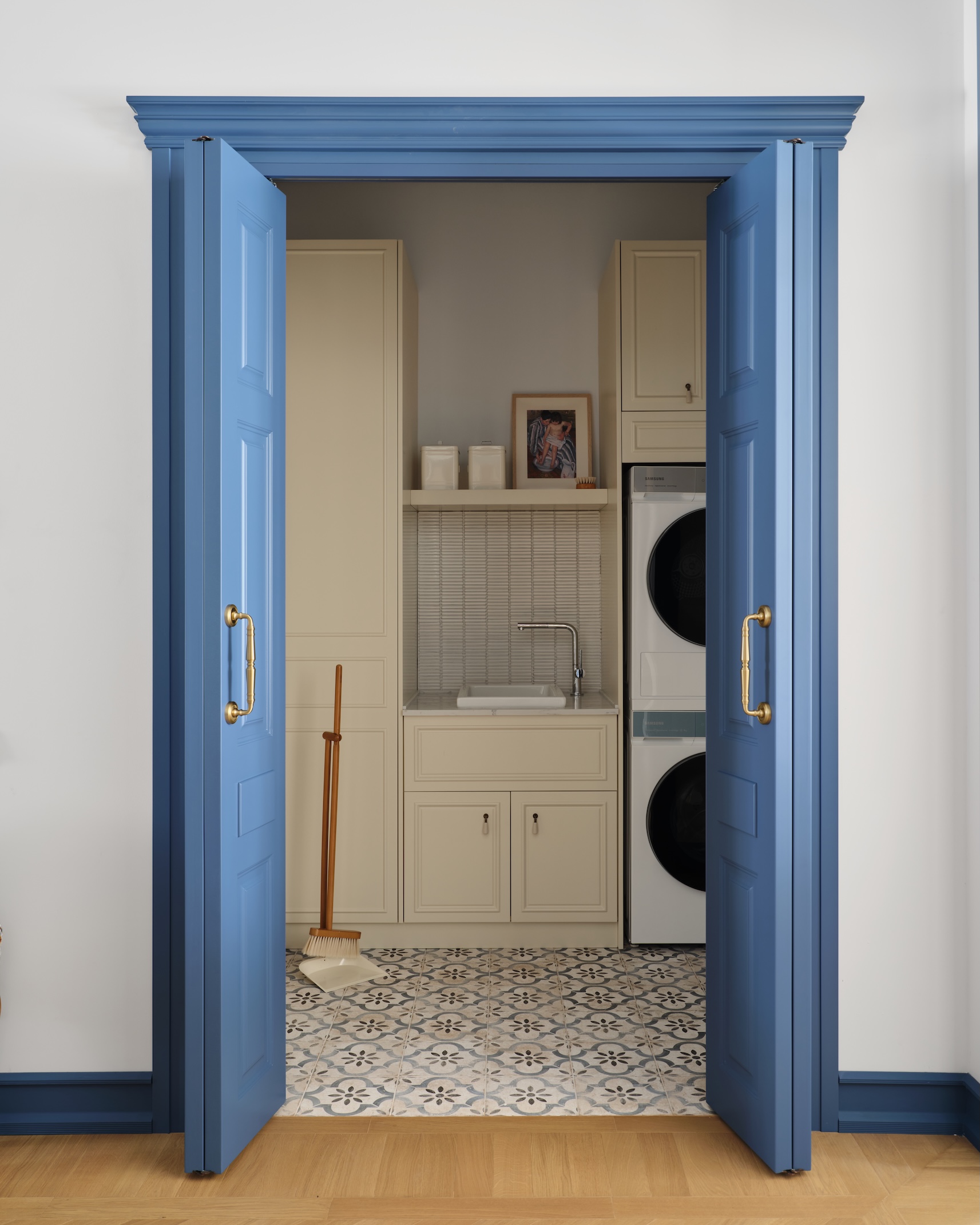 around the corner, fariz created a pocket laundry room with built in cabinets a 25