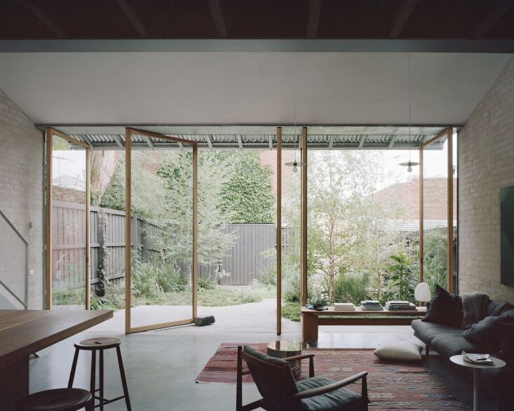 the view from inside the great room to the the back garden, which was designed 20