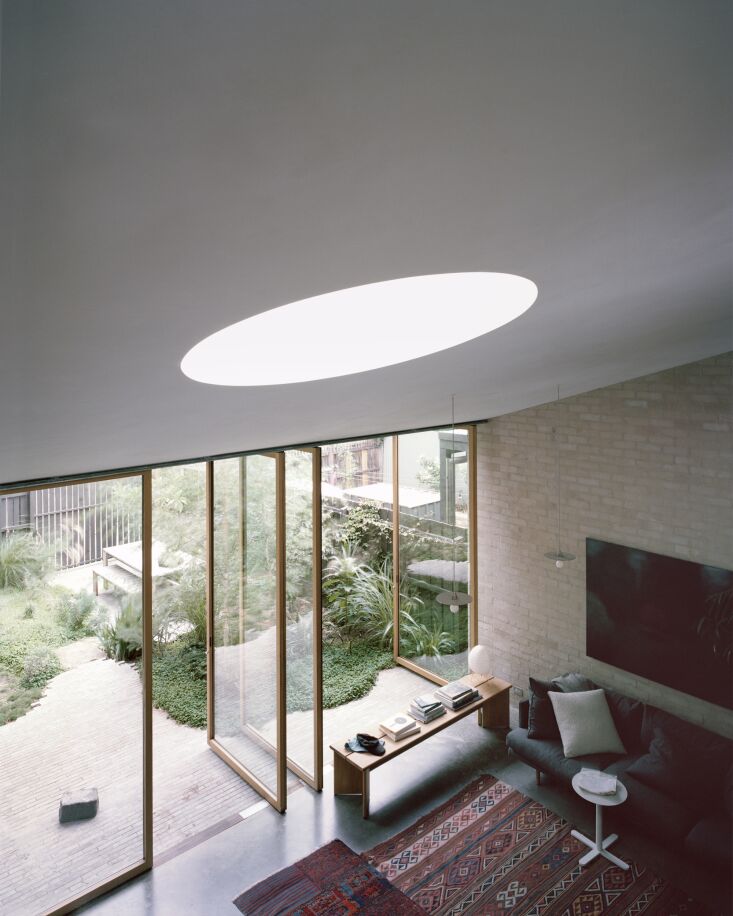 a circular lightwell beams in natural light from overhead. 28