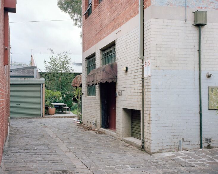 a sliding gate at the back opens up to the alley, where their kids often play. 22