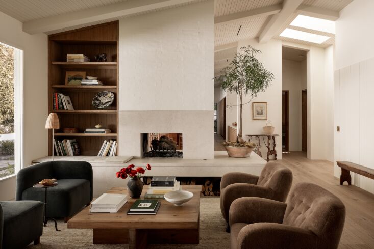 the oak and limestone materials palette extends into the living area. 21