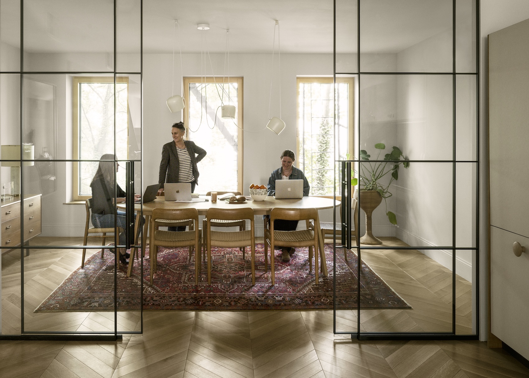 like the ground floor, the second story is open flow with glazed partitions—a 21