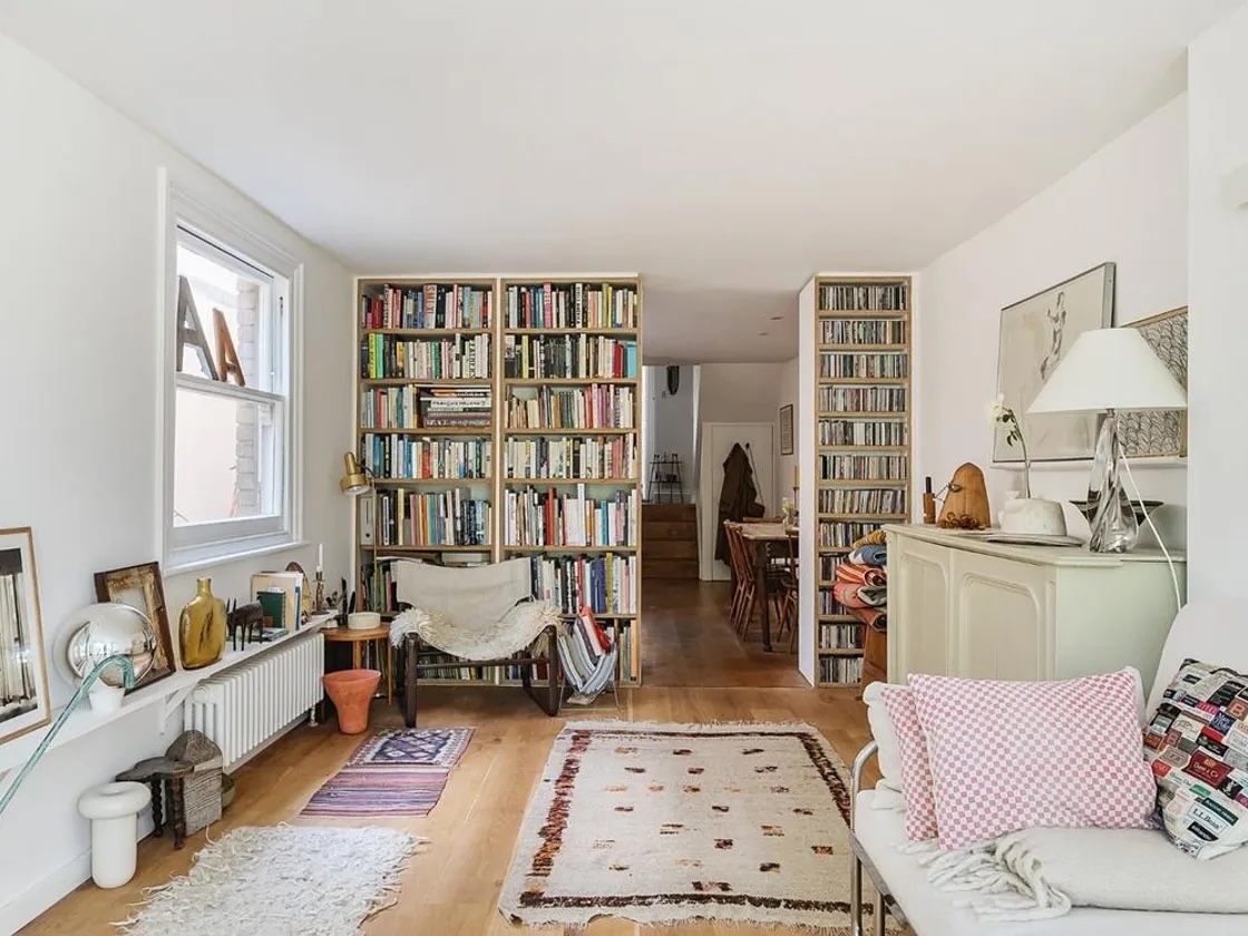 to divide the living area from the kitchen, sandy put up bookshelves of birch f 27