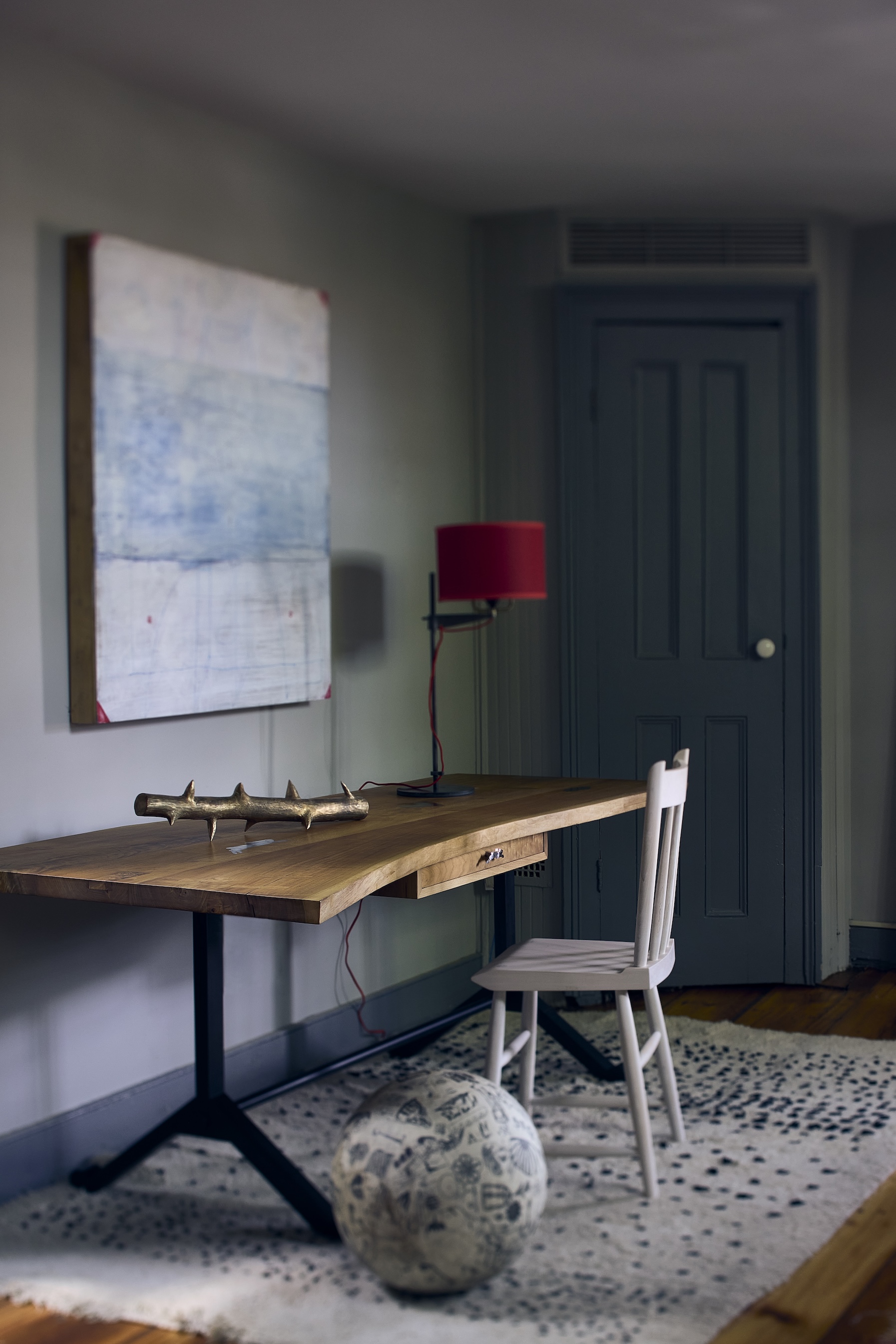 a walnut desk with a waterjet cut steel base holds one of jonah\2\17;s b 26