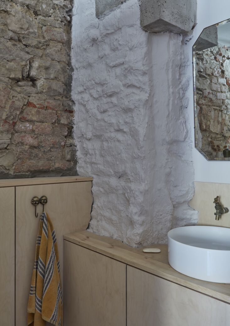 birch plywood bathroom cabinets were built into old brickwork and plastered sto 25