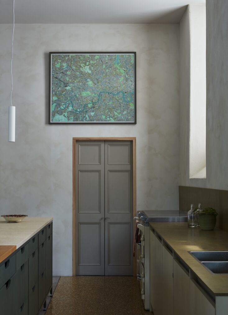 the sink side of the island is fitted with plywood drawers with cut out handles 20