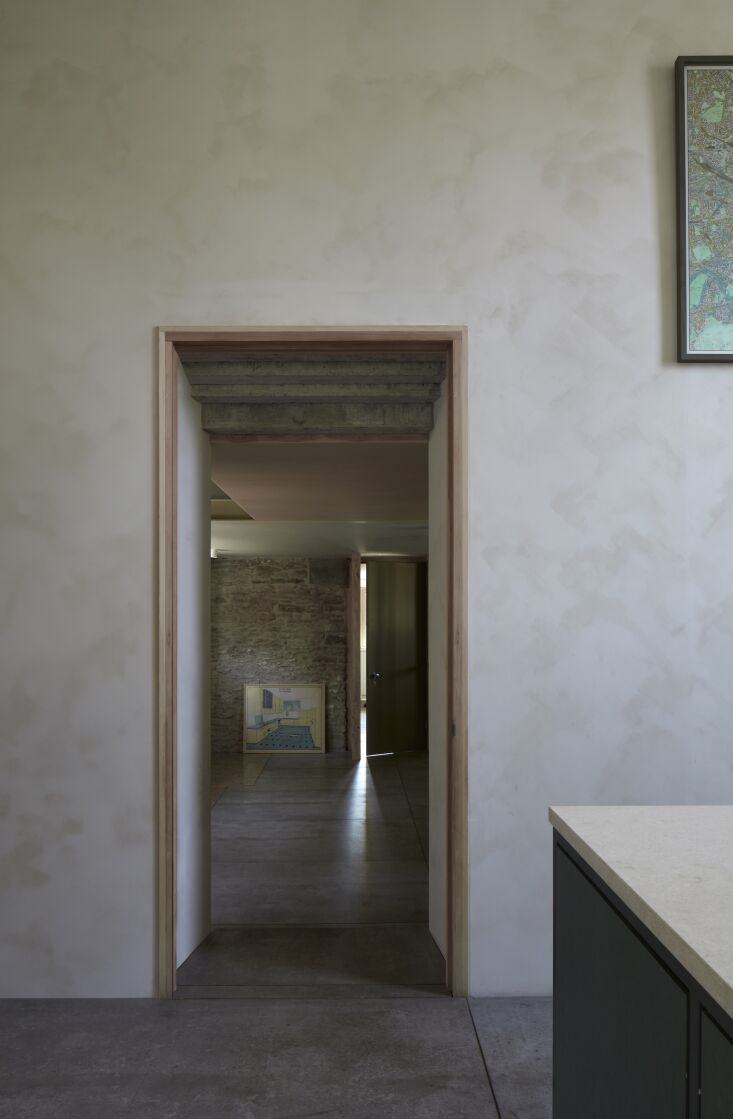 the view from the kitchen to the front atrium and stair. the walls are finished 21