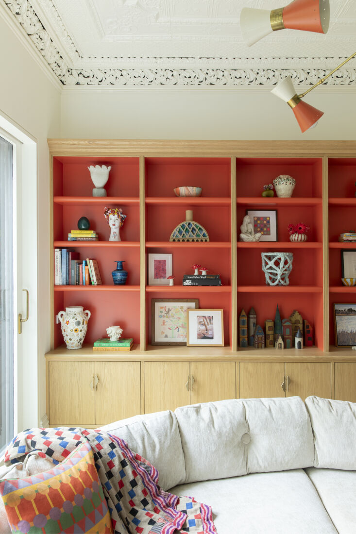 the cubbies of the built in storage unit and the metal shades on the mid centur 24
