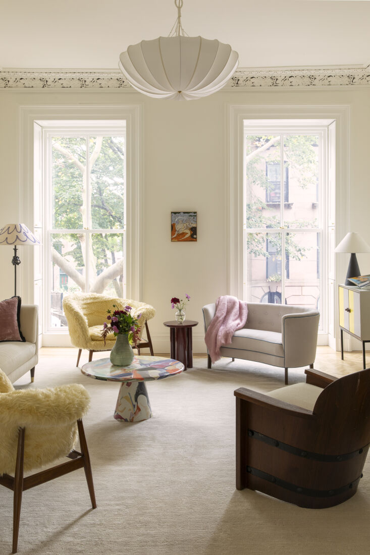in the formal living room, vintage yellow armchairs, a crescent shaped settee,  21