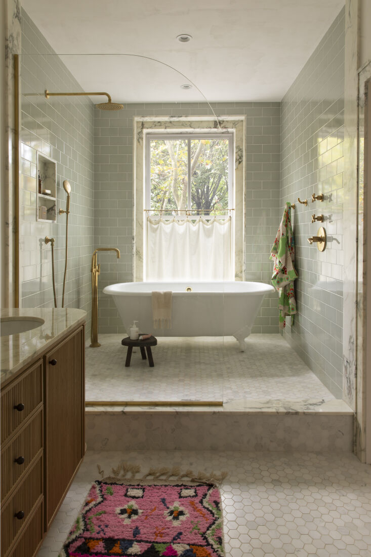 a luxurious splash zone defines the ensuite. \2\20;the window looks over 27
