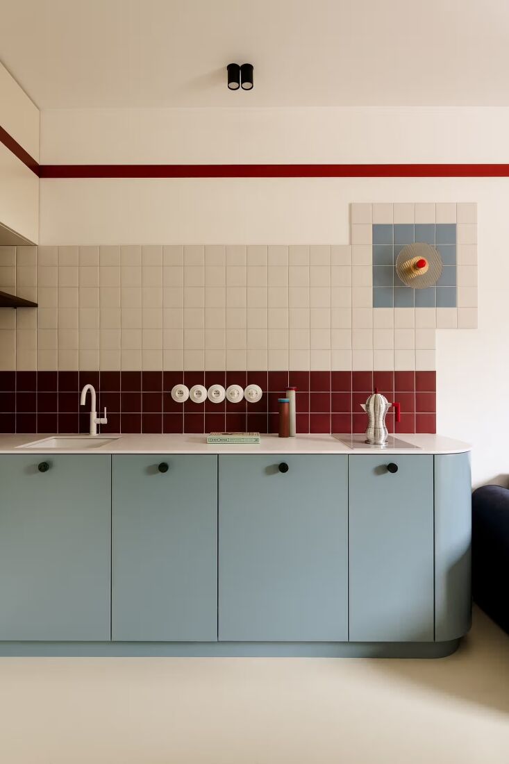 burgundy meets blue in an apartment kitchen on the outskirts of warsaw by misto 24