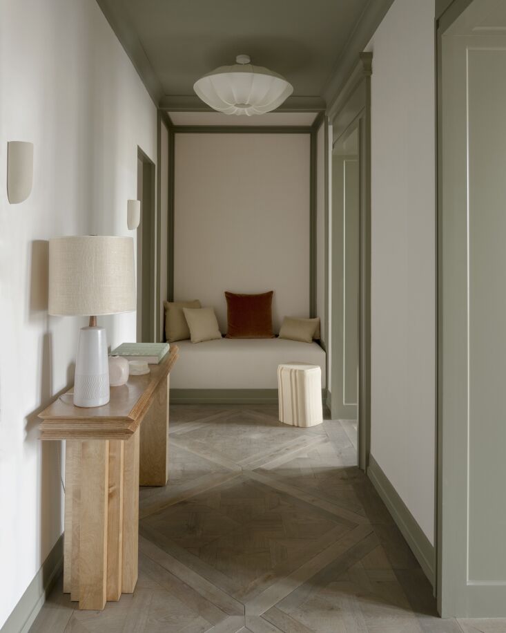 the main entrance is designed with custom sconces, a vintage silk ceiling lamp, 17