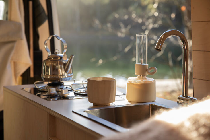 there\2\17;s a two burner gas cooktop and sink (two jerry cans underneat 22