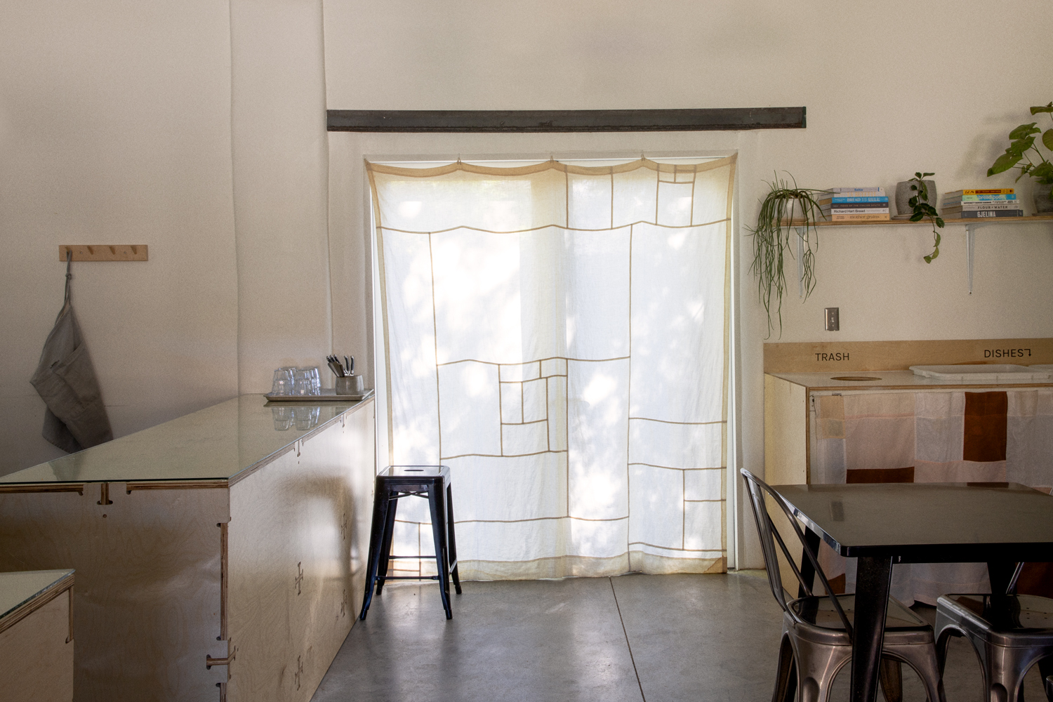 joey used cotton that he dyed with black tea to stitch patchwork curtains for t 28