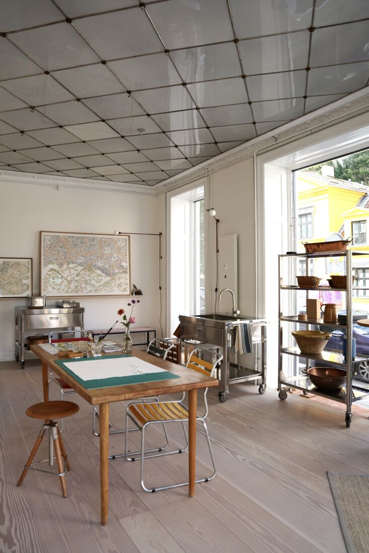 bonde\2\17;s studio table is at the center of the space with a vintage s 18