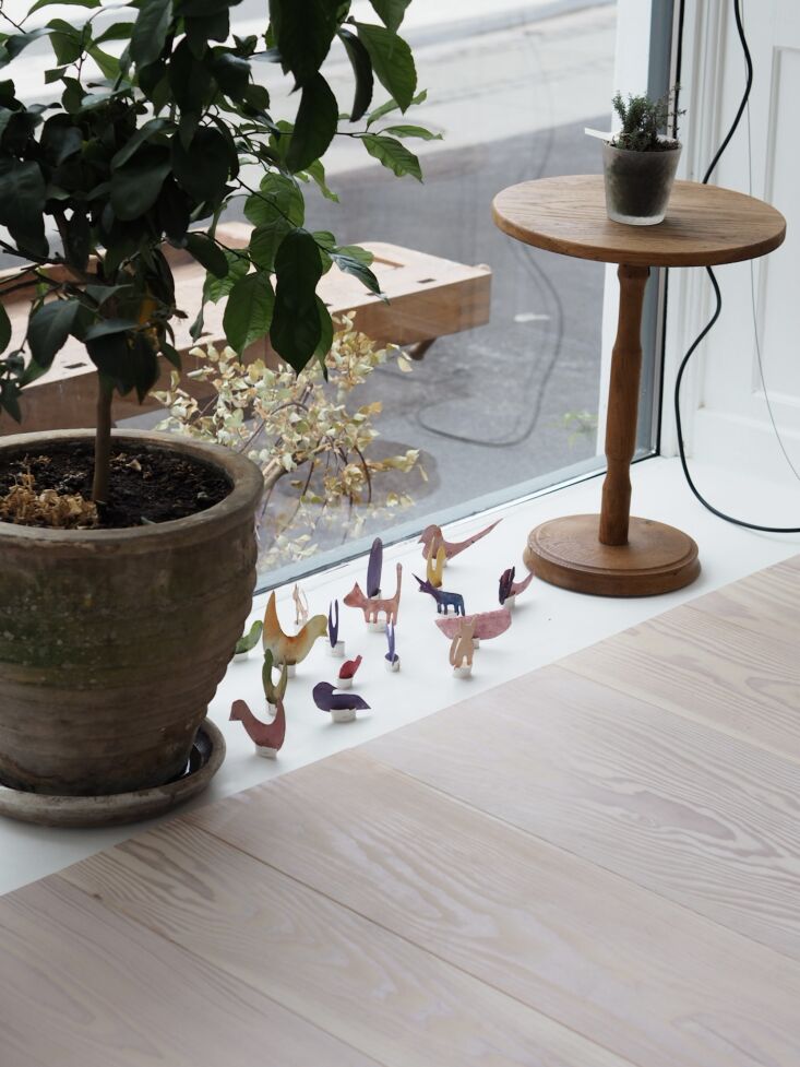 small hand painted paper figurines from bonde in the window display. 24