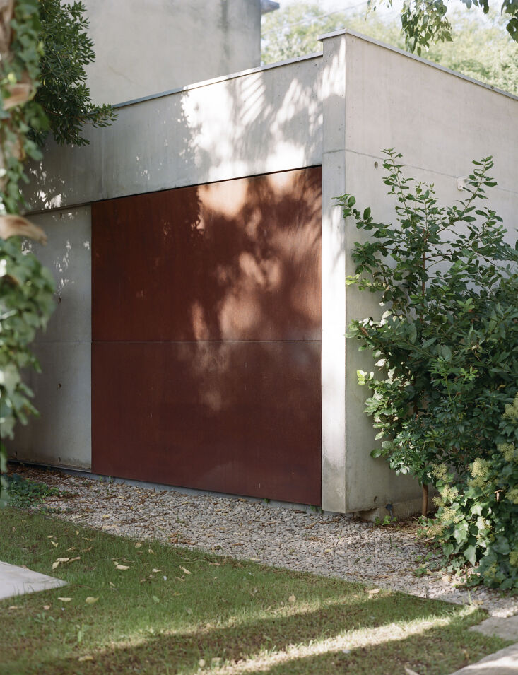 the outbuilding door is made of corten steel. 33