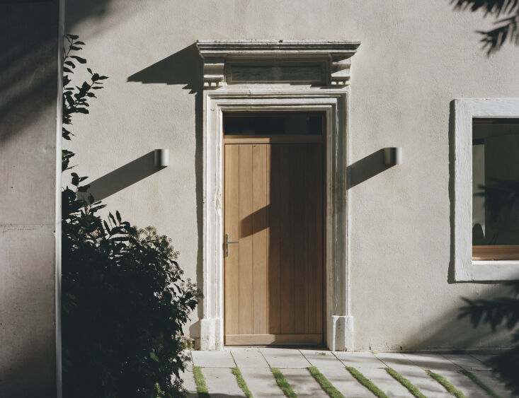 the front door is a blend of old (historic frame exterior) and new (wood door). 18