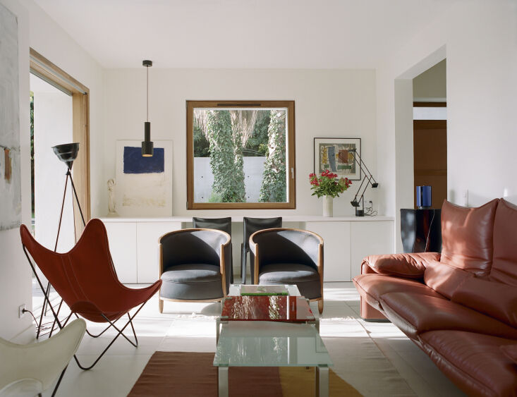 the living room sofa is the vico magistretti \1973 maralunga and the two club c 21